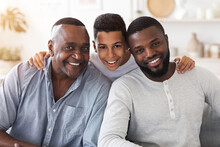 Joyful African Son, Dad And Grandfather Posing For Family Picture At Home