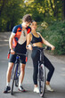 © hetmanstock2 - People with a bikes. Couple in a forest. Morning bike ride.