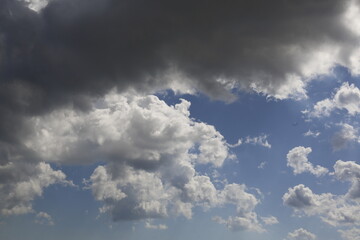 Wall Mural - white fluffy clouds in the blue sky.