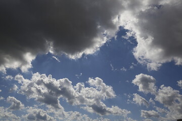 Wall Mural - white fluffy clouds in the blue sky.