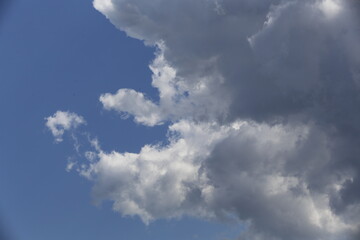 Wall Mural - white fluffy clouds in the blue sky.