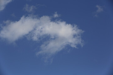 Wall Mural - white fluffy clouds in the blue sky.