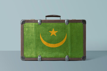 Wall Mural - Mauritania flag on old vintage leather suitcase with national concept. Retro brown luggage with copy space text.