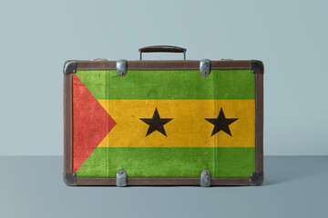 Wall Mural - Sao Tome And Principe flag on old vintage leather suitcase with national concept. Retro brown luggage with copy space text.