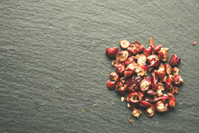 Wild Rose Hip Dry Fruit On The Black Rock Surface 