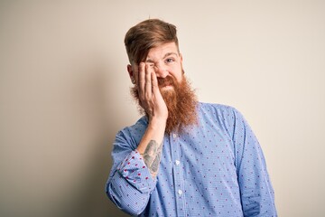 Sticker - Handsome Irish redhead business man with beard standing over isolated background thinking looking tired and bored with depression problems with crossed arms.