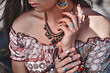 Gorgeous stylish boho chic woman. Fashionable indian hippie gypsy bohemian outfit with bijouterie accessories details