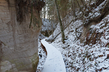 Small sandstone canyon covered with a snow. Estonia.