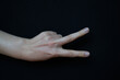 © Fizzl - Isolated woman hand closeup making gestures on black background