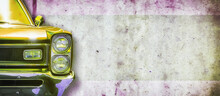 Headlight Of An Old Beautiful Yellow Car On A Concrete Wall Background. Copy Space Concept For Repair Banners, Car Sale.