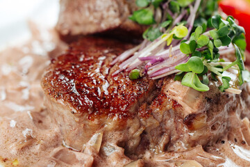 Wall Mural - Fillet mignon steak with onion sauce and greens