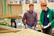 © alfa27 - handsome man consults with warehouse worker in uniform, which size of wooden board will be suitable