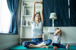Asian woman exercise yoga, work out at home with children play around