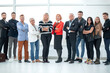 © ASDF - Group of business people in an office lined up