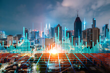 FOREX Graph Hologram, Aerial Night Panoramic Cityscape Of Kuala Lumpur. KL Is The Developed Location For Stock Market Researchers In Malaysia, Asia. The Concept Of Fundamental Analysis.