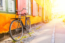 Old Yellow House Of Nyboder District With A Bicycle. Old Medieval District In Copenhagen, Denmark