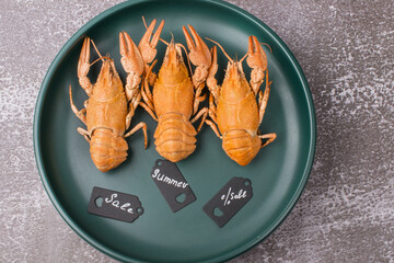 Boiled crawfish on a green plate. Kitchen of the restaurant selling dishes.