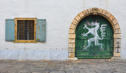 Old windows and door of the Styrian Armoury (Landeszeughaus), in the city center of of Graz, Austria, the world's largest historic armoury