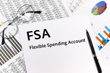 Wall Mural - Flexible spending account FSA written on the sheet. pen, glasses, documents, graphics.