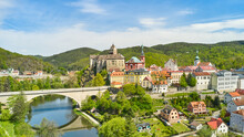 Panoramic view of Loket castle and bridge over the river Ohri , Czech Republic.