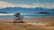 Boat Aground On The Beach Of The General Carrera Lake, Chilean Patagonia
