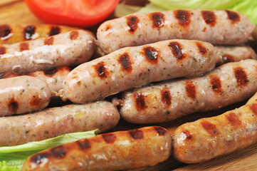 grilled smoked sausages, lettuce leaves, tomatoes