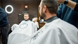 © Svitlana - Family visiting barbershop. Cute and happy boy looking at his father with smile while getting haircut together in barbershop. Web banner