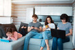 © Vlad - Big family at home. Everyone uses their own gadget. Dependence on social networks and mobile games. Tablet, smartphone and laptop instead of fun talking in the evening