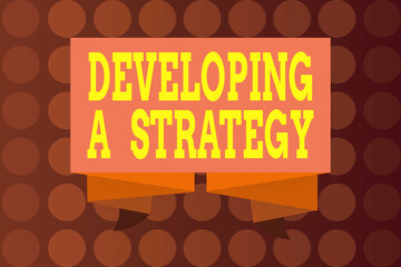 Poster - Word writing text Developing A Strategy. Business photo showcasing Discussing the Ideas for New Goal Marketing Vision Planning Business Ribbon Sash Folded and Pleated Decorative Banner Strip