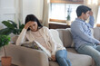 © fizkes - Unhappy young caucasian couple sit on sofa back to back think of marriage dissolution or divorce, upset millennial man and woman struggle with family relationships problems, breakup concept