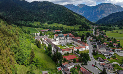 Ettal Abbey, called Kloster Ettal, a monastery in the village of Ettal, Bavaria, Germany - aerial photography