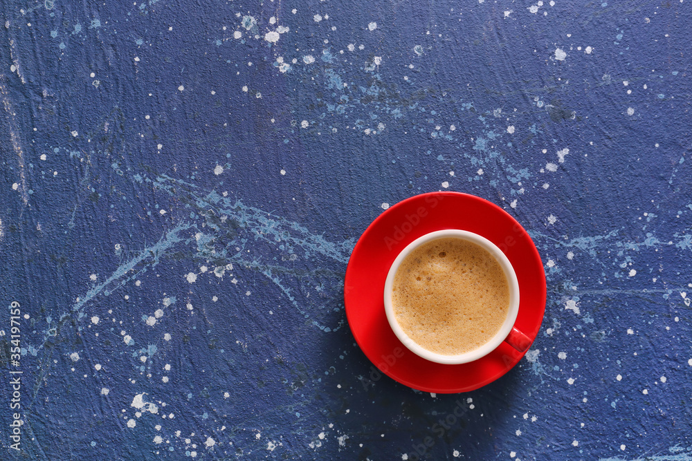 Cup of tasty coffee on color background