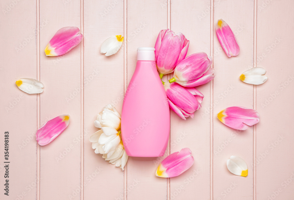 Shower gel on white wooden background