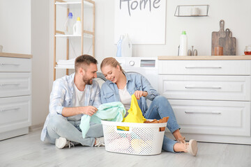 Sticker - Happy couple doing laundry at home