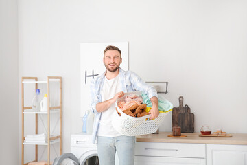 Sticker - Young man doing laundry at home