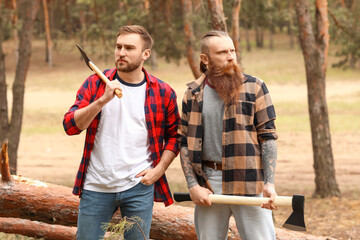 Wall Mural - Portrait of handsome lumberjacks in forest