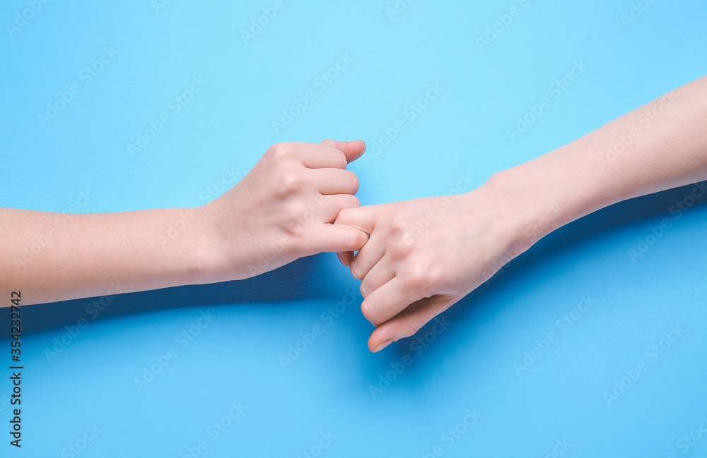 Pinky grip on color background. Unity concept