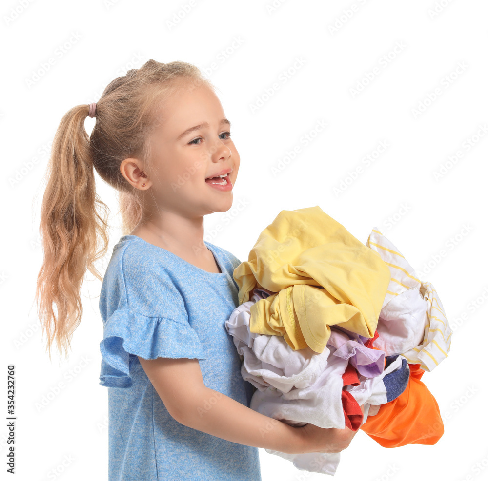 Cute little girl with dirty laundry on white background