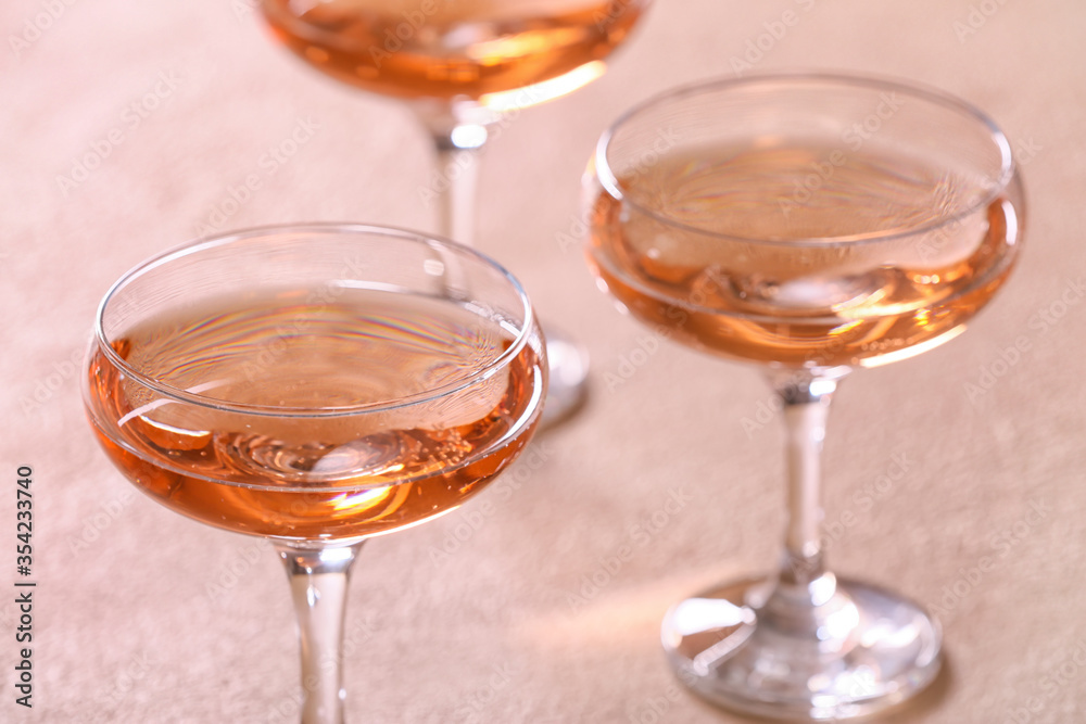 Glasses of tasty champagne on table