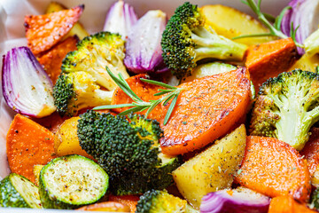 Wall Mural - Baked vegetables in the oven dish. Grilled sweet potato, zucchini and broccoli. Healthy vegan food concept.