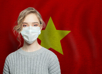 Wall Mural - Young woman wearing a face mask with flag. Flu epidemic and virus protection concept