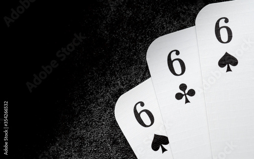 Fotomural white playing cards 666 six of spades and six of clubs in the right lower corner