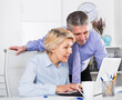 © JackF - Mature man helping his colleague