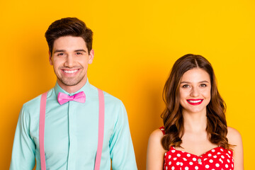 Poster - Photo two amazing beautiful people lady handsome guy toothy smiling prom couple wear red dotted dress shirt bowtie elegant retro clothes isolated yellow bright color background