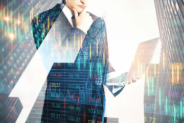 Poster - Businessman holding laptop computer and falling chart hologram