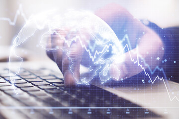 Poster - Hand using laptop and recession chart with digital earth hologram