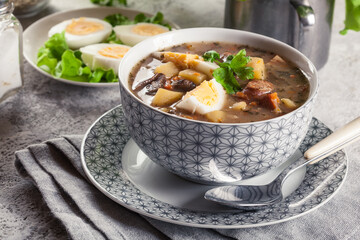 Poster - The sour soup made of rye flour with mushrooms served with eggs