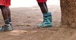 Photo of children's legs in boots. Kenya, Africa
