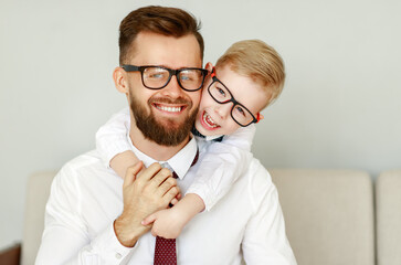 happy father and son hug at home.