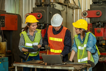 Poster - Group of engineer workers in a factory,Teamwork concept.